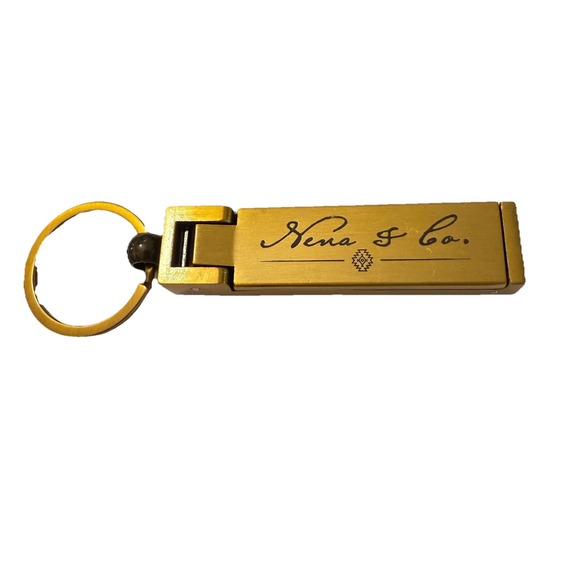 Nena & Co. Accessories - Vintage Nena & Co Purse Holder Keychain Bag Charm Gold Tone Pendant Designer Y2K